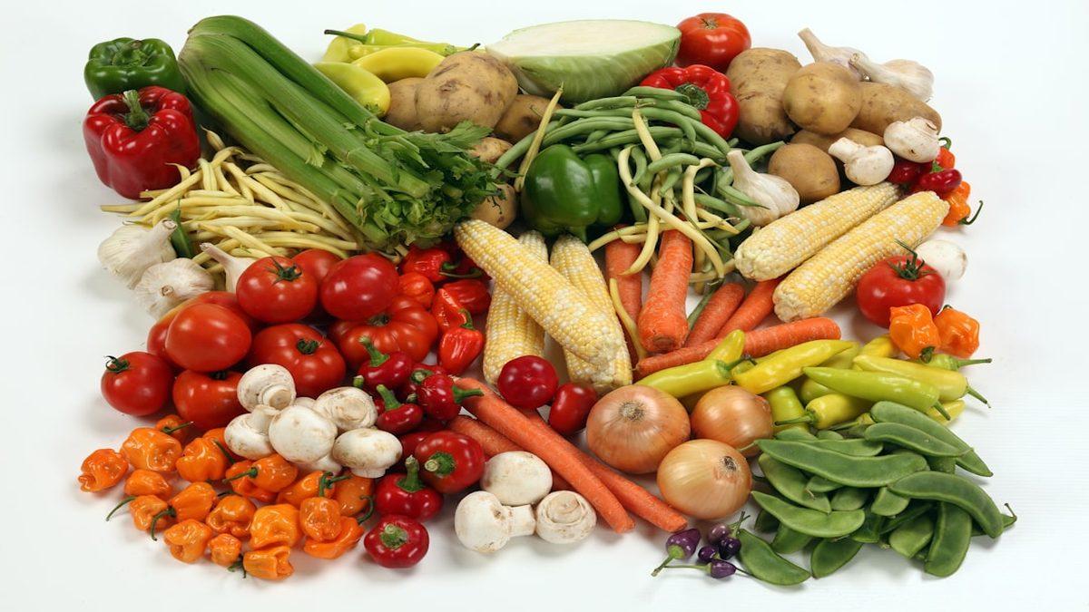 ancestral eating plant-forward — fresh seasonal vegetables on wooden table