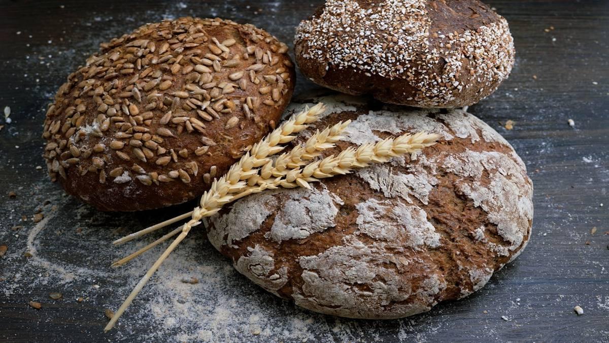 ancestral eating plant-forward — whole grains and legumes in ceramic bowls