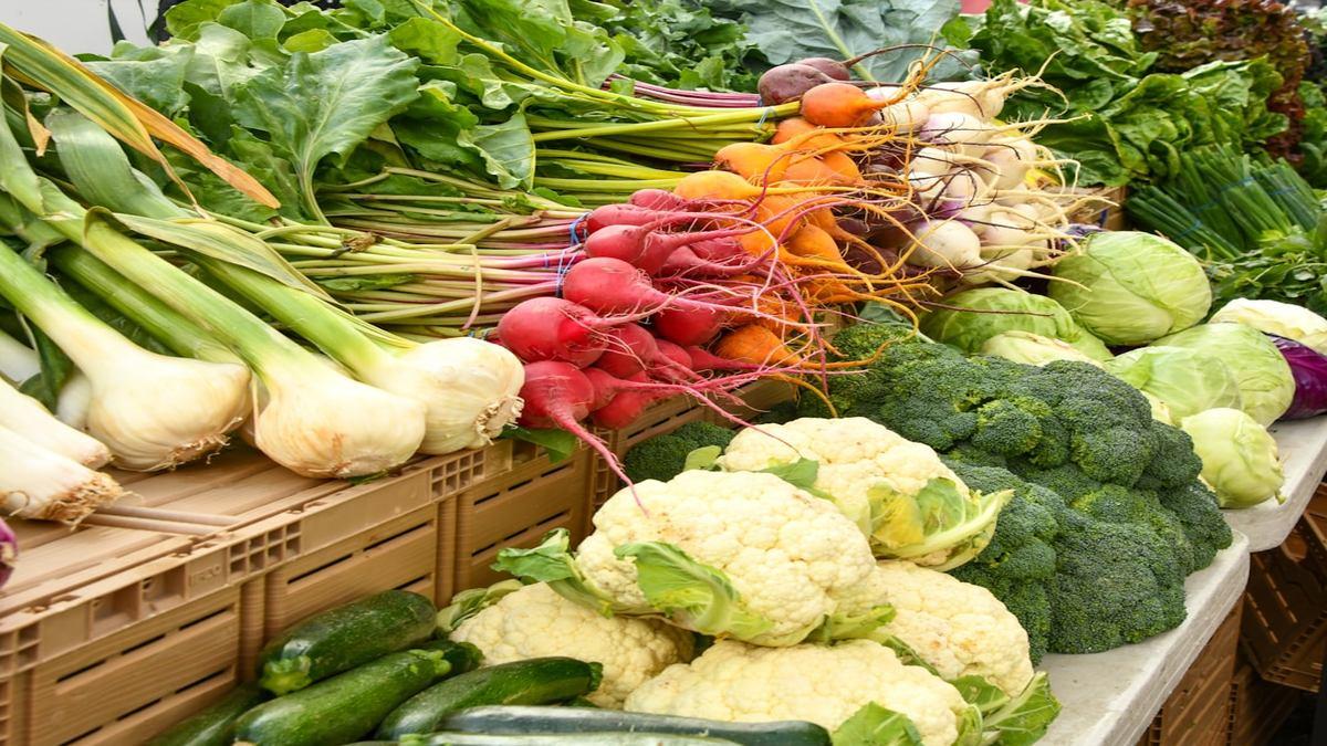 ancestral eating plant-forward — colorful farmers market produce display