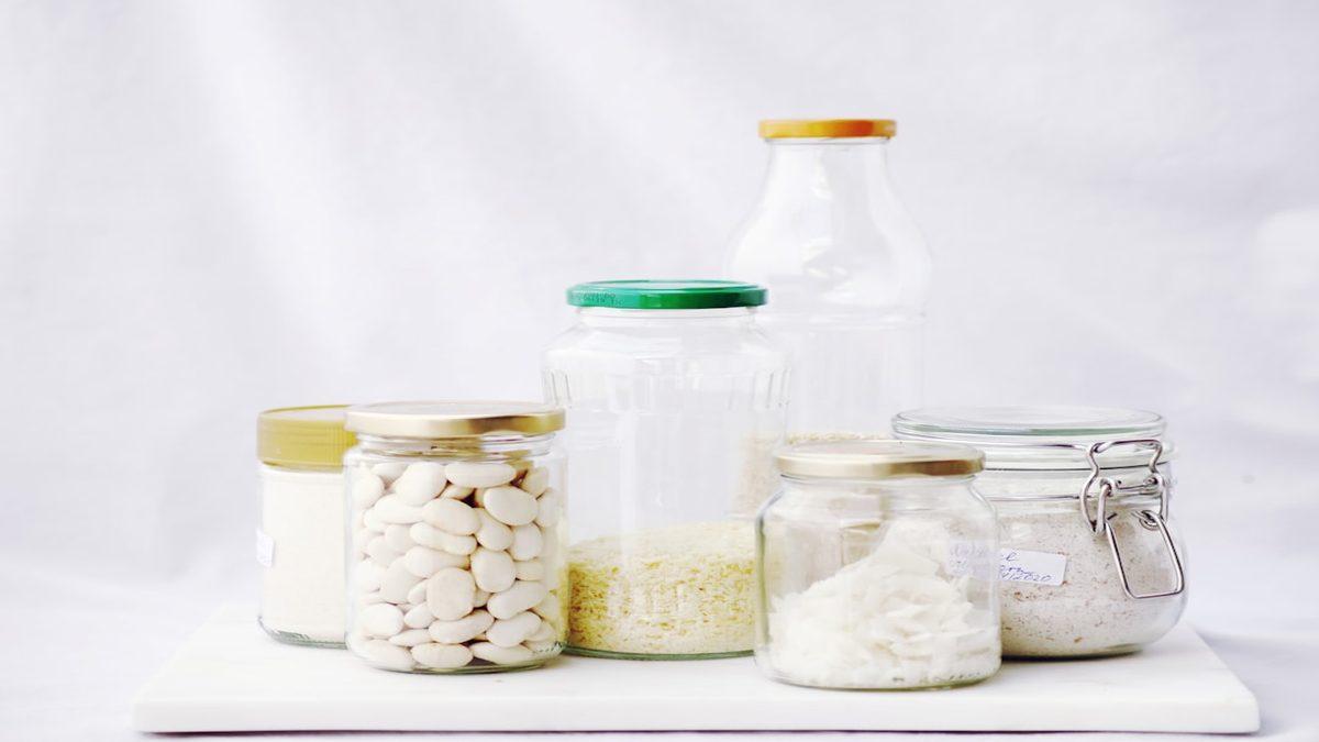 fiber-rich plant foods ancestors — glass jars filled with whole grains and seeds