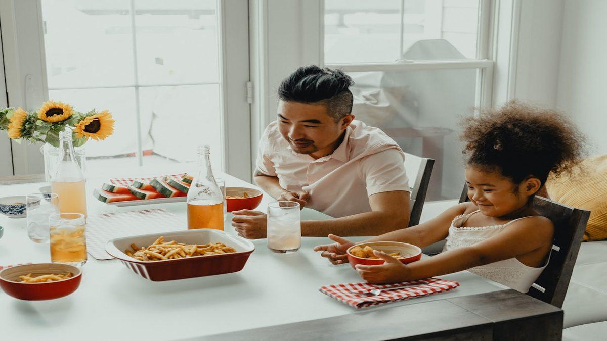 plant-forward meals kids — family enjoying healthy dinner together