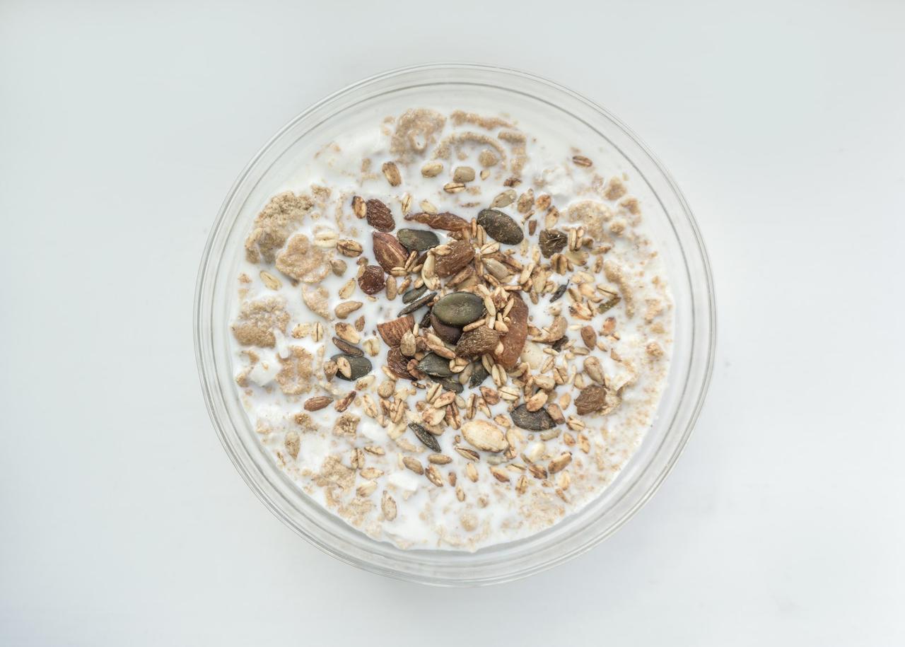 high-protein plant-based breakfasts — overnight oats topped with nuts and seeds