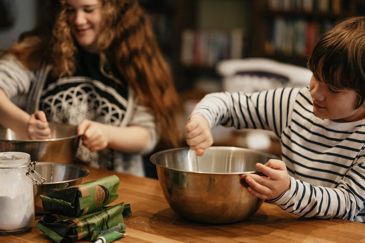 transition family to plant-based meals — parents and children cooking together