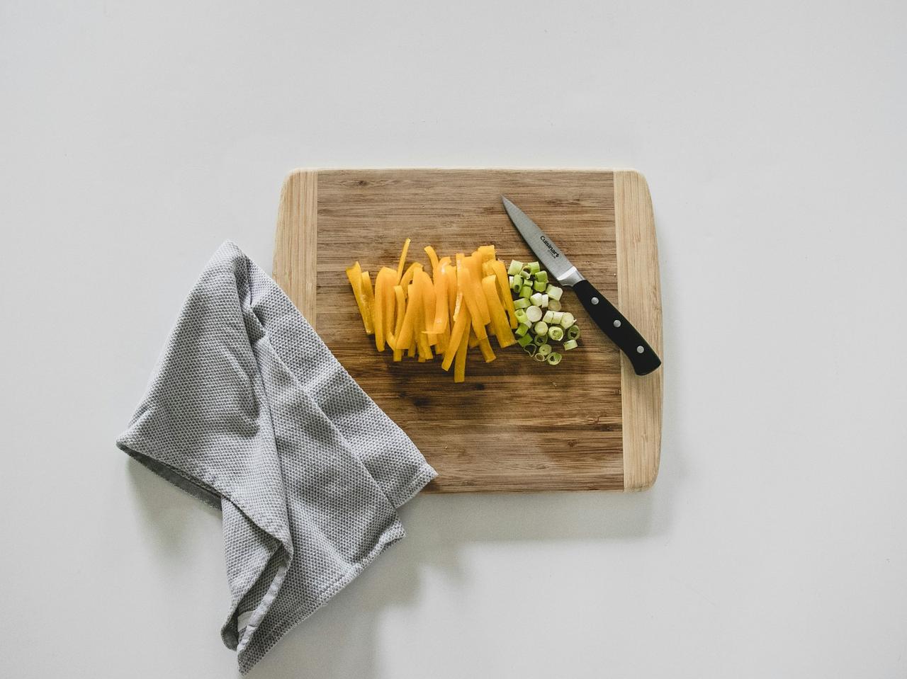 simple plant-based meal prep — fresh ingredients on wooden cutting board in bright kitchen